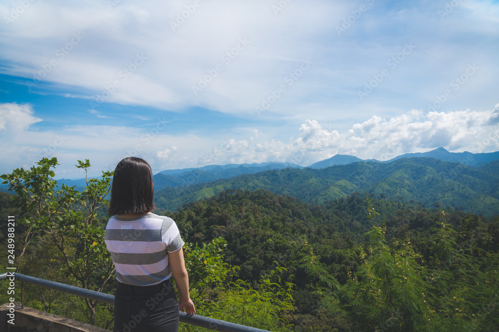 Happy young cute Asian Japanese girl hipster backpack  women travelling looking at beautiful sky mountains scenery views 