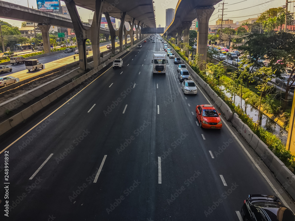 Bangkok, Thailand - March 14, 2017: Traffic flow at the street in front of Central Bangna department store, Bangna-Trad expressway from Bangkokk to Trad province, the far eastern part of Thailand.