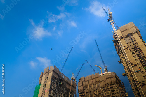 Bild auf Leinwand View of construction of multi-storey residential building