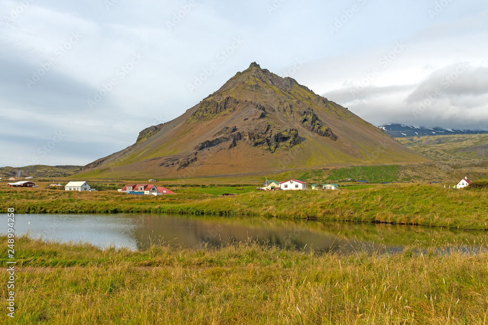 Scenic Hills and Wetlands by an Icelandic Village