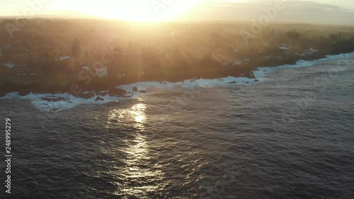 aerial sunset of populated coastline on big island of Hawaii photo