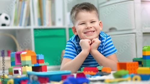 Wallpaper Mural Preschool boy is playing with different colorful toy bricks in a kindergarten Torontodigital.ca