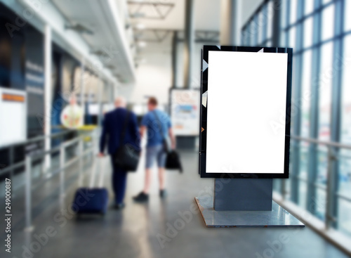 Digital media blank black and white screen modern panel, signboard for advertisement design in a shopping centre, train station, mock up with blurred background, digital kiosk, airport.