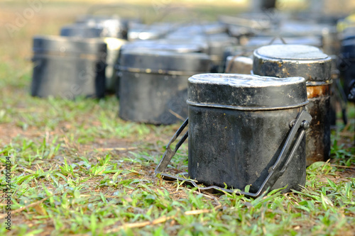 pot for camping Black pot and golden food plate for soldiers in field training.black Strand