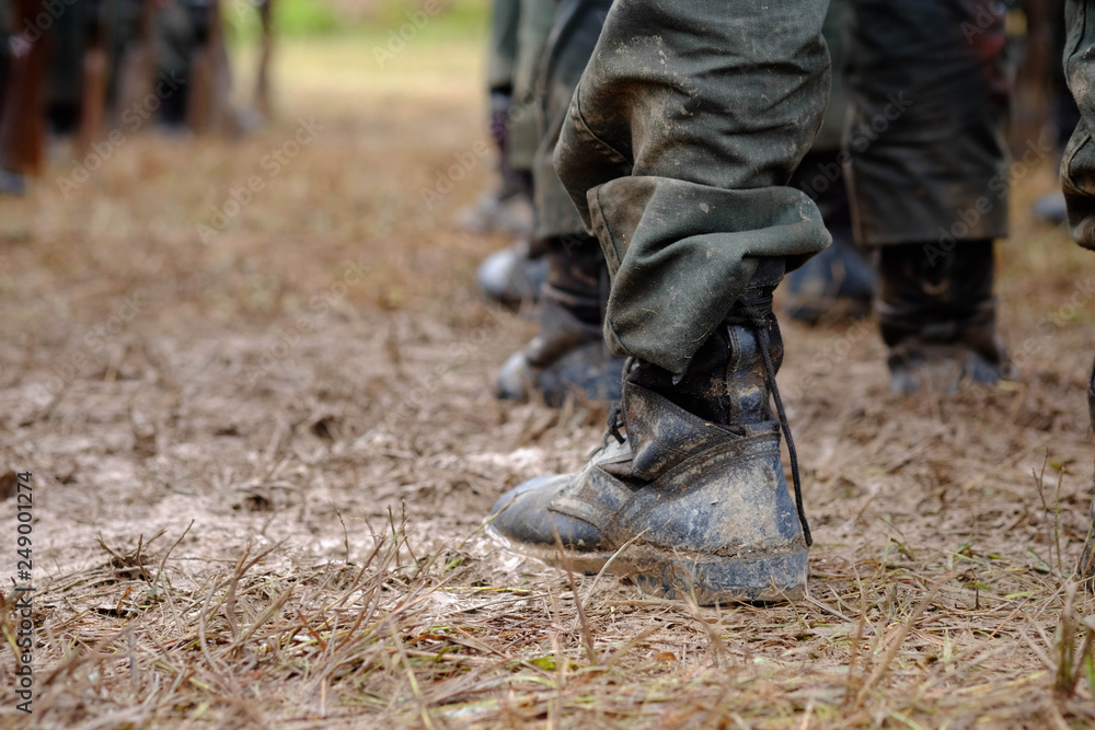 Black shoes of soldiers stained with mud Black shoes of soldiers stained with mud