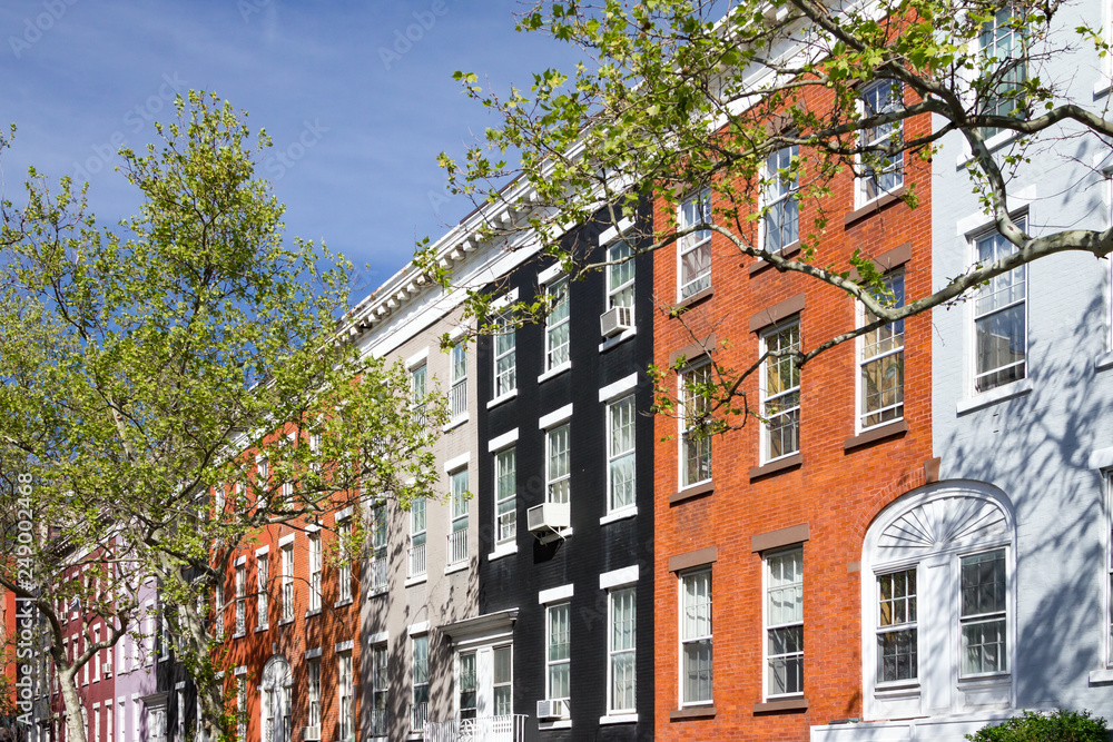 Fototapeta premium Block of colorful row houses on Macdougal Street in the Greenwich Village neighborhood in New York City