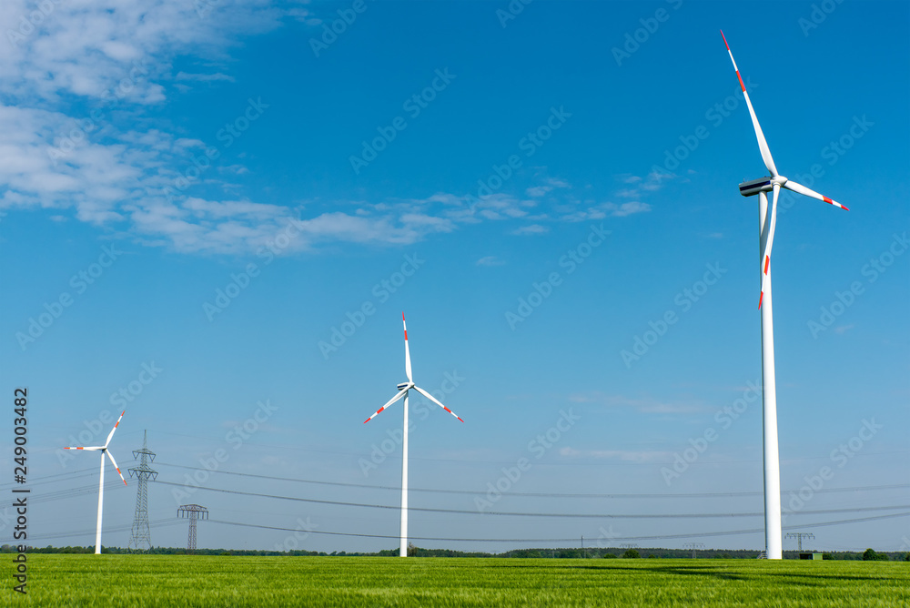 Overhead power lines and wind turbines seen in Germany Overhead power lines and wind turbines seen in Germany