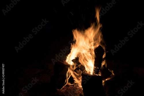 Wood buring fire isolated on black