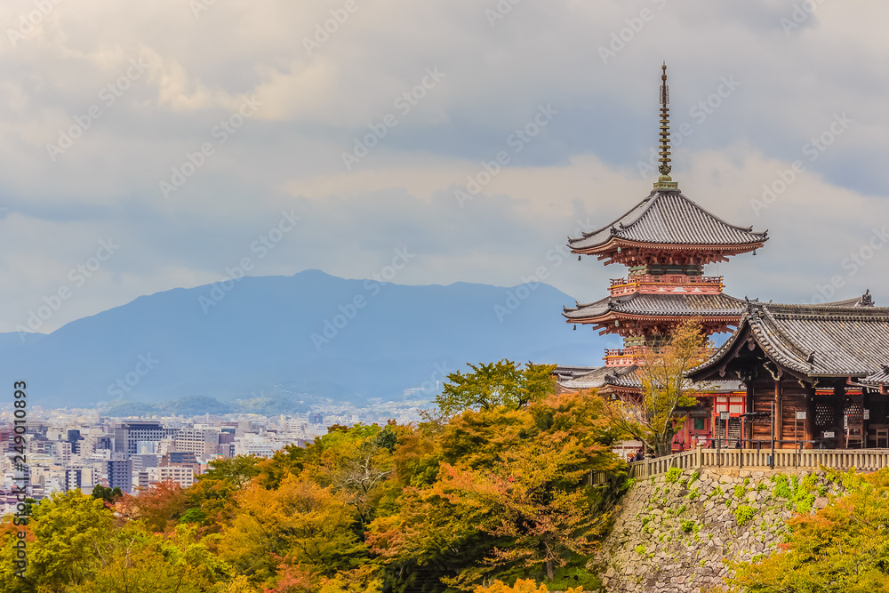 View of Kyoto city from Kiyomizu temple with dramatic cloudy sky on background.
