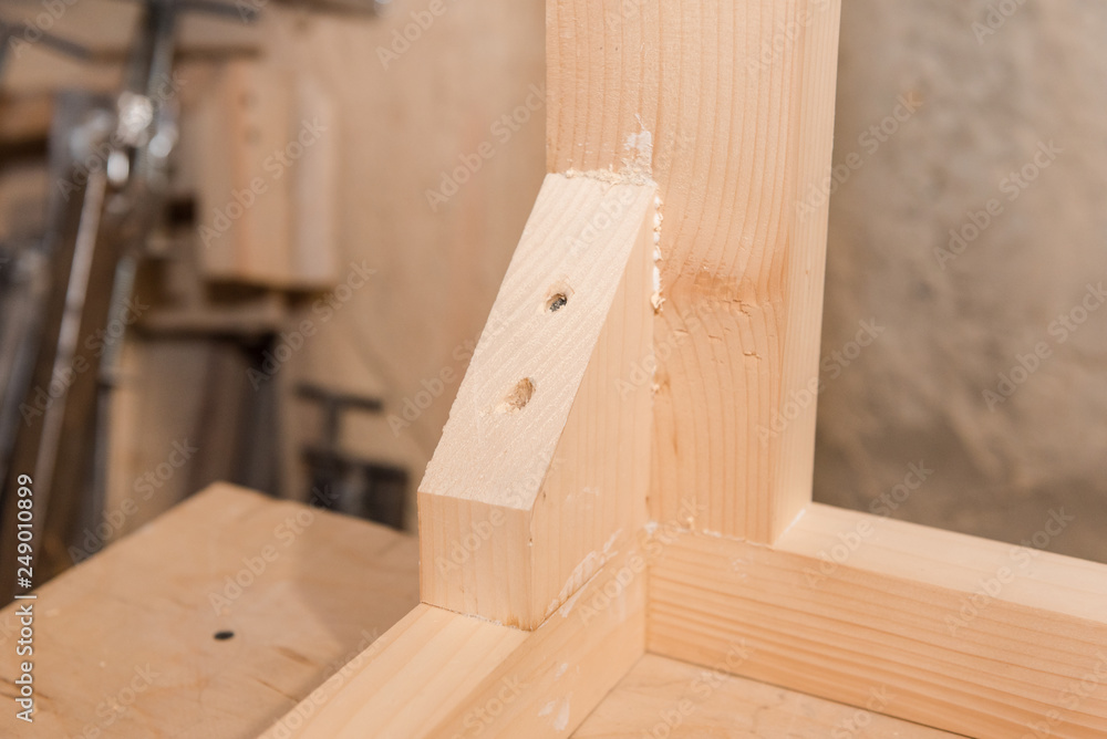 Wooden details. Details glued to each other. Carpentry workshop.