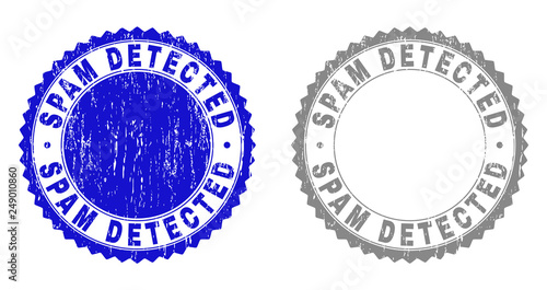 Grunge SPAM DETECTED stamp seals isolated on a white background. Rosette seals with grunge texture in blue and gray colors. Vector rubber watermark of SPAM DETECTED caption inside round rosette.
