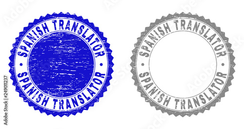 Grunge SPANISH TRANSLATOR stamp seals isolated on a white background. Rosette seals with grunge texture in blue and gray colors. Vector rubber overlay of SPANISH TRANSLATOR text inside round rosette.