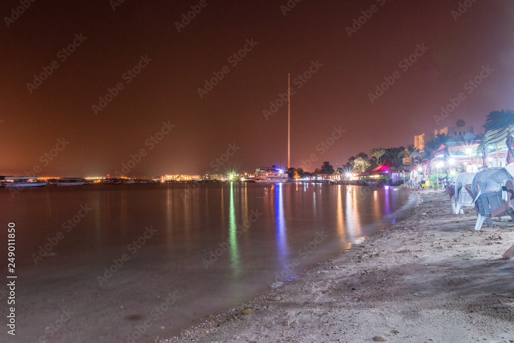 Seashore of Gulf of Aqaba at Aqaba city in Jordan at night.
