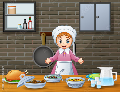 Cute cheerful woman cooking and preparing food in the kitchen