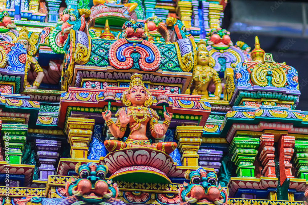 Colorful night view of indian gods sculpture at Sri Maha Mariamman Temple, also known as Maha Uma Devi temple, the public hindu temple in Silom, Bangkok, Thailand. It known as Wat Khaek Silom.