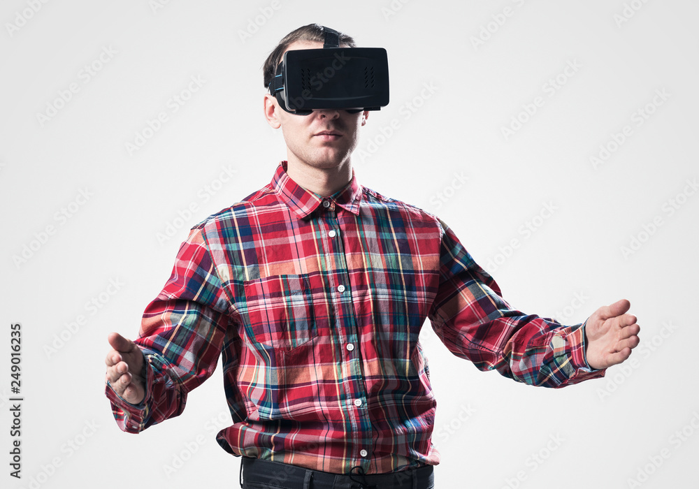Guy in mask experiencing virtual reality as new entertainment device Guy in mask experiencing virtual reality as new entertainment device