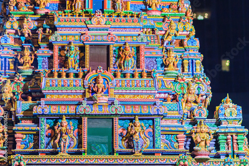 Colorful night view of indian gods sculpture at Sri Maha Mariamman Temple, also known as Maha Uma Devi temple, the public hindu temple in Silom, Bangkok, Thailand. It known as Wat Khaek Silom. © kampwit