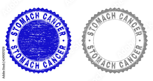 Grunge STOMACH CANCER stamp seals isolated on a white background. Rosette seals with grunge texture in blue and gray colors. Vector rubber stamp imitation of STOMACH CANCER tag inside round rosette.