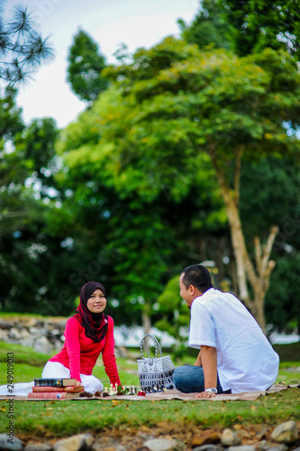 Couple outdoors enjoying a evening day looking happy together. Malay couple in Malaysia