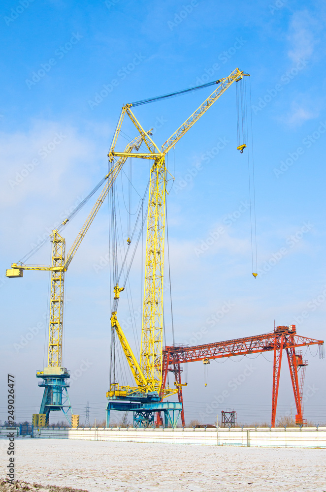 Sevefal tower cranes. gantry cranes against the blue sky. Russia Sevefal tower cranes. gantry cranes against the blue sky. Russia