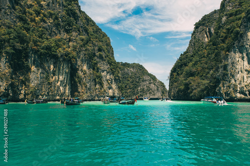 view of iconic tropical turquoise water Pileh Lagoon surrounded by limestone cliffs, Phi Phi islands, Thailand  © Artur