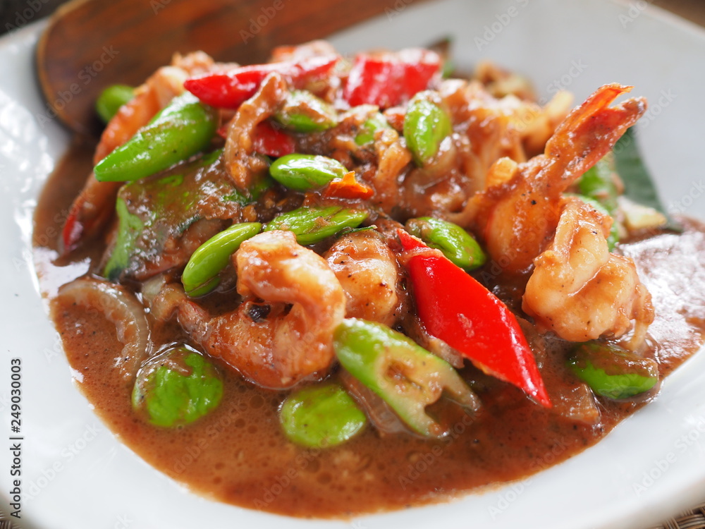 Stir Fried Shrimp with Sataw and Shrimp Paste, Thai Southern style food called Stir Fried Shrimp with Sataw and Shrimp Paste, Thai Southern style food called