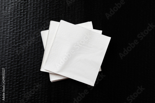 Paper napkin on black background.