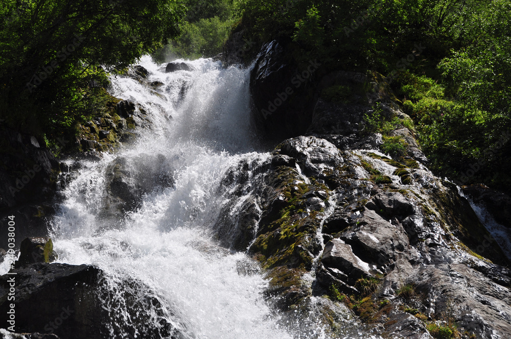 Naklejka premium Waterfall scenes in mountains, national park Dombai, Caucasus, Russia, Europe