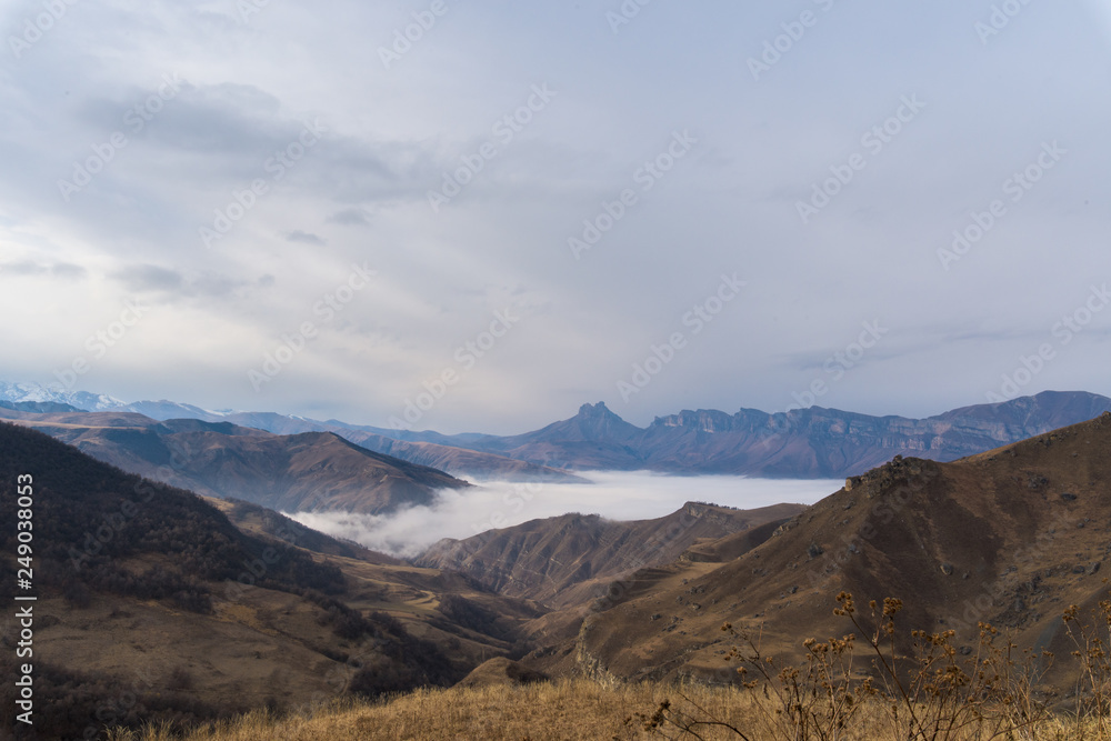mountains in clouds. the cloud between the peaks of the mountains. Caucasian mountain area. panoramic view