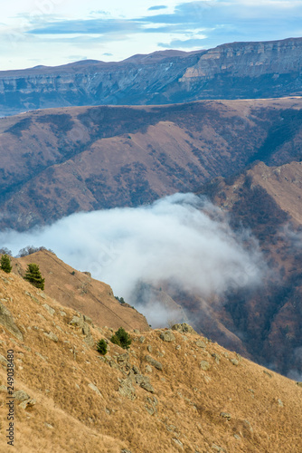 mountains in clouds. the cloud between the peaks of the mountains. Caucasian mountain area. panoramic view