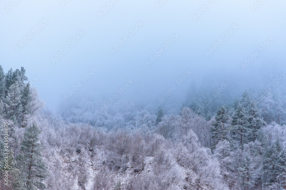 the clouds over the mountains. mountainous terrain, frost. winter landscape. the clouds over the mountains. mountainous terrain, frost. winter landscape.