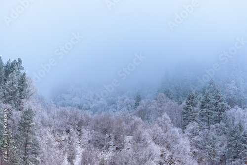 the clouds over the mountains. mountainous terrain, frost. winter landscape.