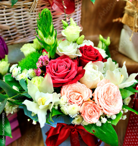 Beautiful bouquet of various flowers with a central composition of red roses