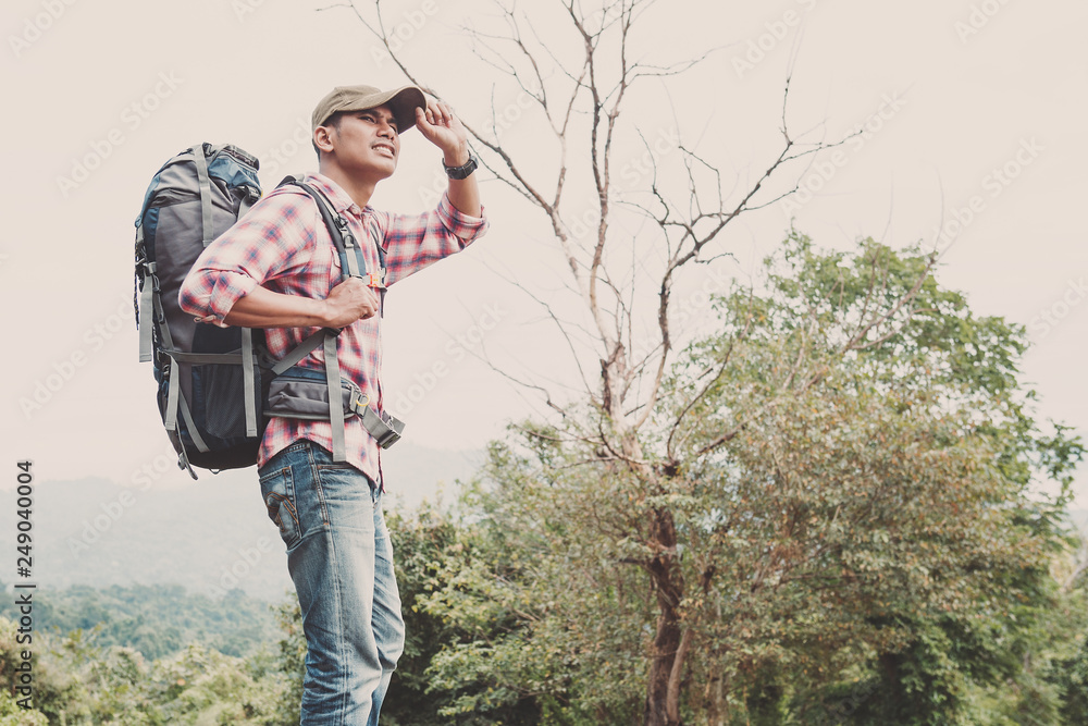 Hiking man traveling with backpack in mountains Hiking man traveling with backpack in mountains