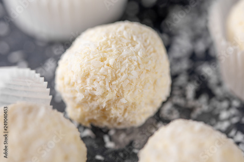 Homemade candy white chocolate and coconut on a dark background. Set Candy truffles snowball.
