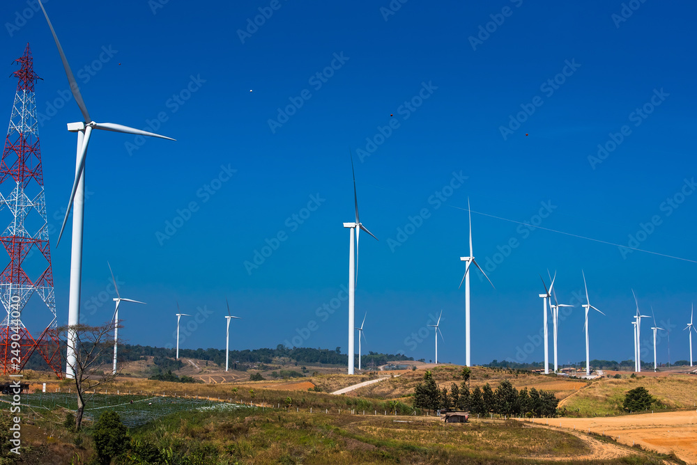 Power of wind turbine generating electricity clean energy with cloud background on the blue sky.Global ecology.Clean energy concept save the world.