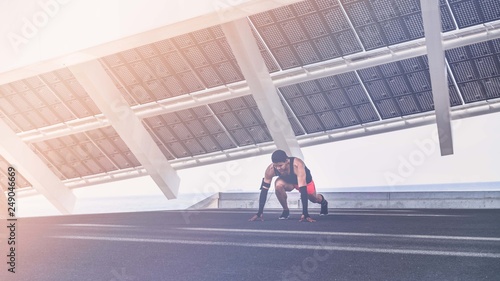 Workout urban outdoor concept. Hispanic Male athlete doing push-up. Sporty muscular young man in t-shirt training or working out outdoors while jogging up the steps, filtered image. Flares