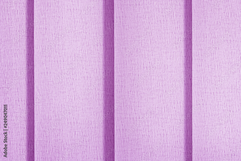 Fototapeta premium Pink blinds vertical blinds in full screen. Close-up of textile surface texture