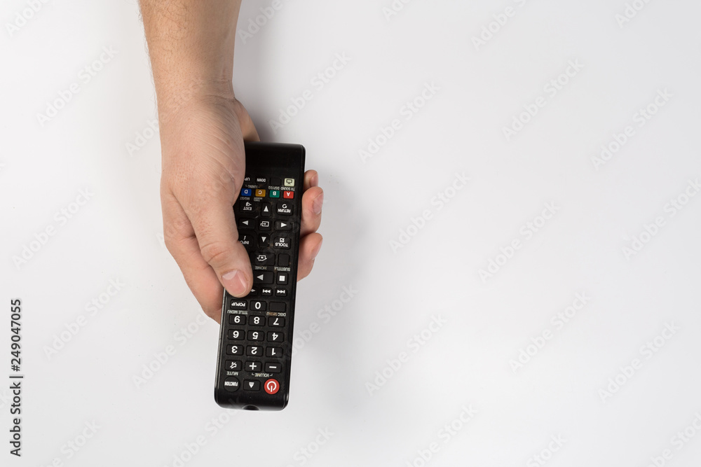 hand with tv remote control isolated on white background hand with tv remote control isolated on white background
