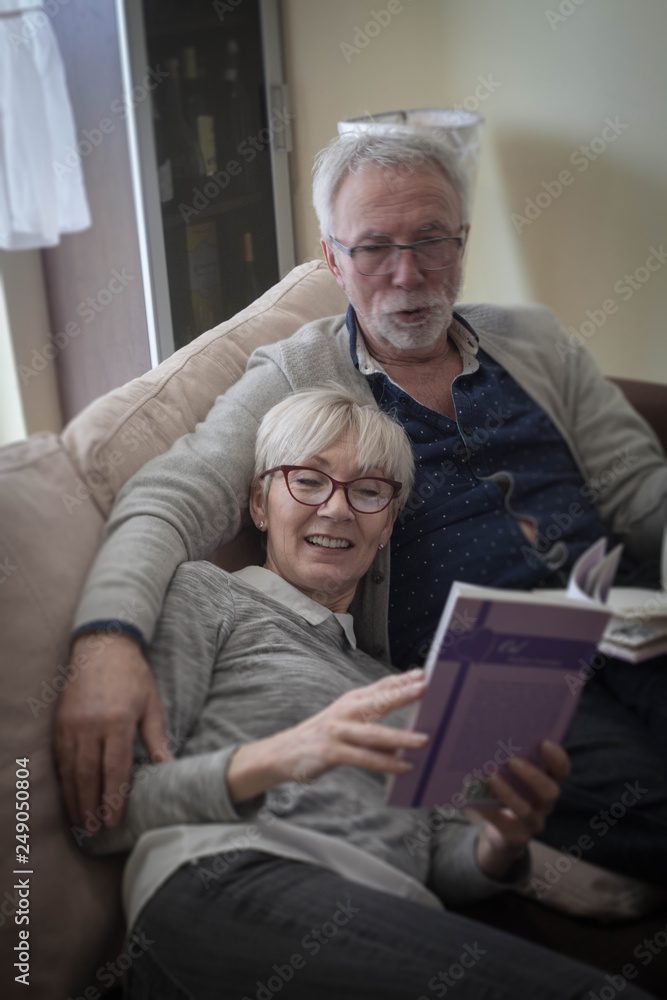 Husband and wife resting at home . Husband and wife resting at home .