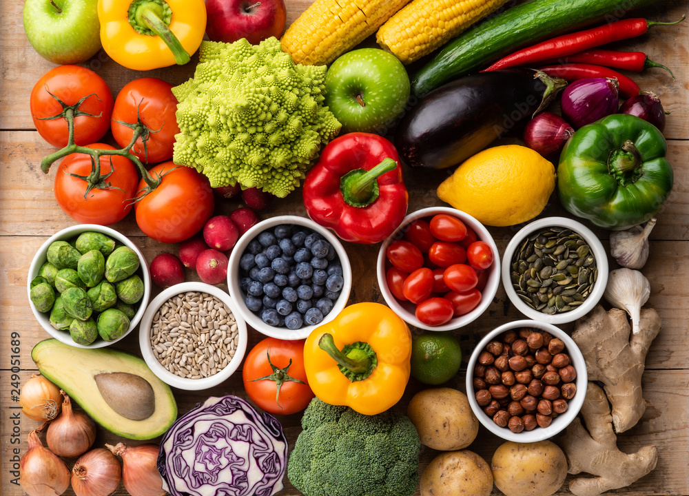 Healthy eating ingredients: fresh vegetables, fruits and superfood. Nutrition, diet, vegan food concept Healthy eating ingredients: fresh vegetables, fruits and superfood. Nutrition, diet, vegan food concept