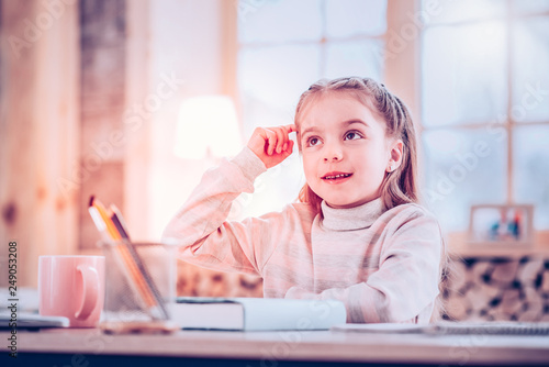Принти на полотні Intelligent schoolgirl thinking about logical Math task