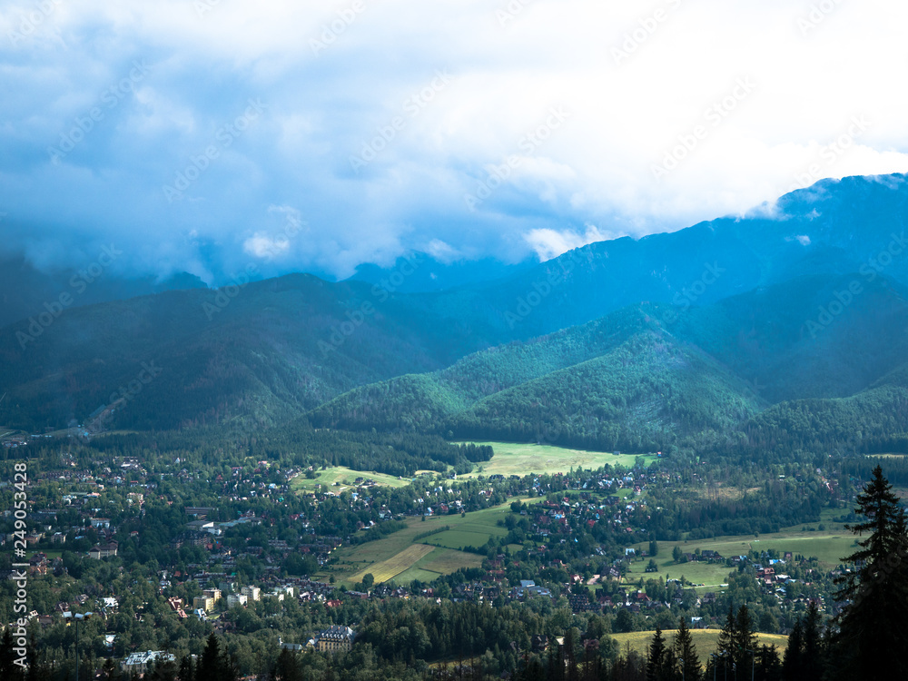 Fototapeta premium A beautiful top view of mountain with cloudy and blue sky.