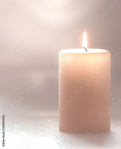 3d rendering. Burning candle pastel brown, soft blurred focus.