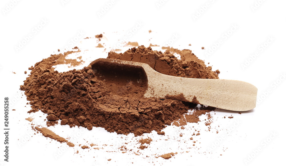 Cocoa powder with wooden spoon isolated on white background Cocoa powder with wooden spoon isolated on white background