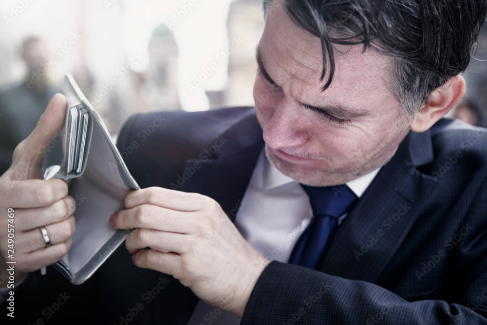 Empty wallet as symbol of poverty and bankruptcy. Selective focus on eyes. Empty wallet as symbol of poverty and bankruptcy. Selective focus on eyes.