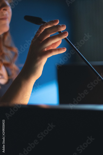 Woman is making a speech with microphone
