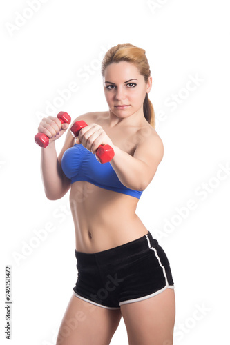 Sporty girl doing exercise with dumbbells © Bashigo