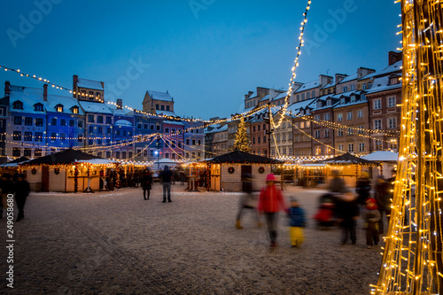 Warsaw old town square with Christmas lights and snow