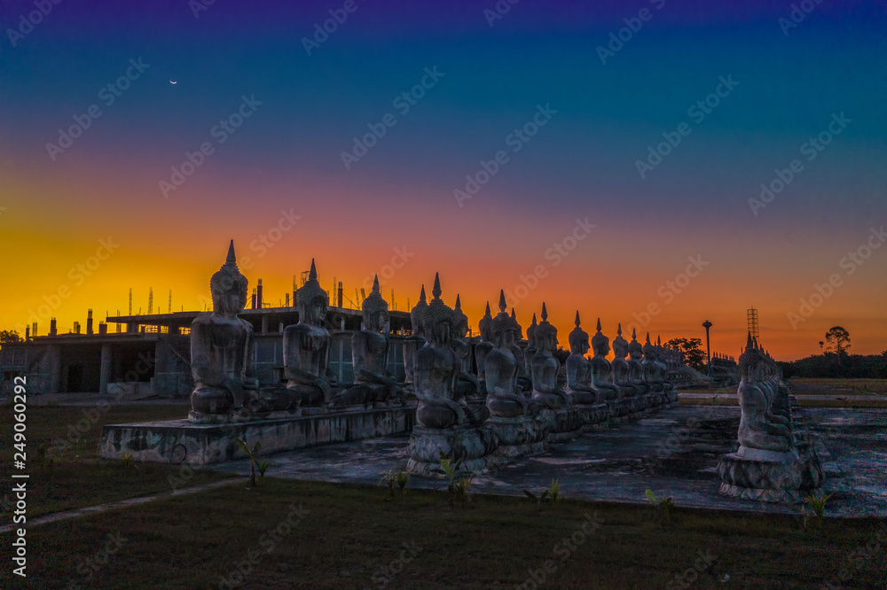 a lot of Buddha statues in twilight at  Tungsong Nakornsrithammarat
